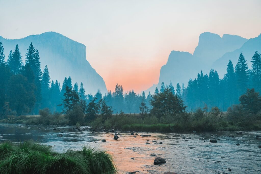 Scenic panoramic view of the best national parks featuring mountains, forests, lakes, wildlife, and hiking trails for outdoor adventure travel.