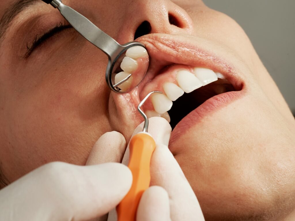 Dentist explaining dental implants and dentures treatment options to a patient during a restorative dentistry consultation.