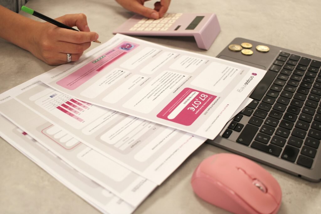 Business professionals reviewing financial reports and payroll data to support long-term growth and financial stability through payroll and bookkeeping services.