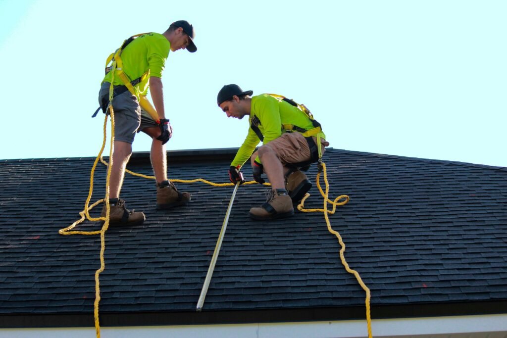 Professional roof washing service cleaning algae and moss from a residential roof to improve curb appeal and protect roof performance.