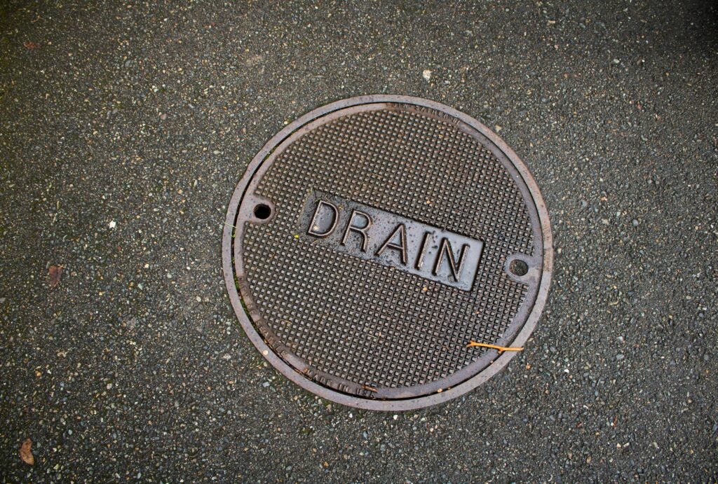 Professional drain jetting service cleaning a sewer pipe using high-pressure water equipment for modern plumbing maintenance and sewer cleaning.