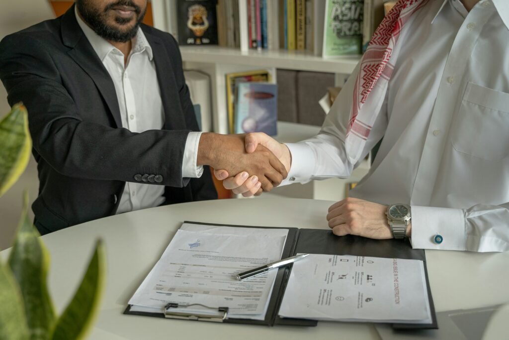Business owner consulting a small business attorney about legal documents and business growth strategies