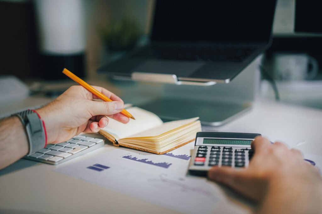 Certified Public Accountant reviewing tax documents and financial records during tax preparation consultation