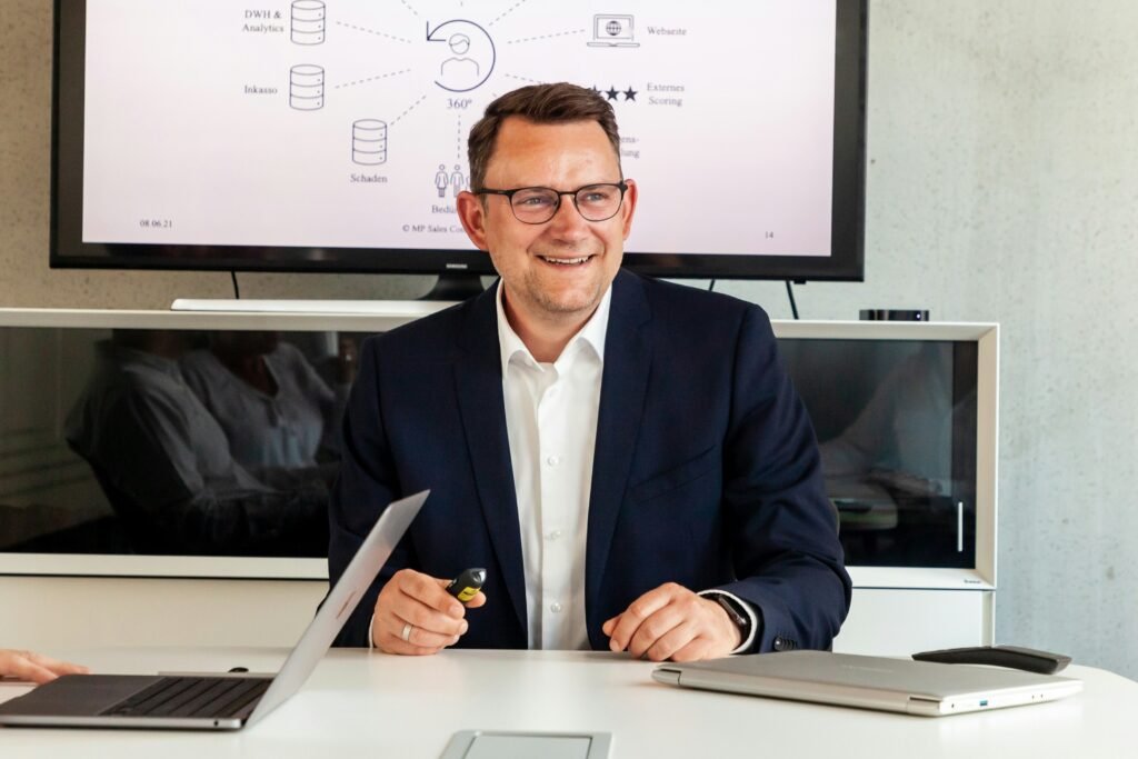 Simon Yiming Ma represented as a private technology entrepreneur with modern office buildings, digital innovation, and financial growth charts in the background.