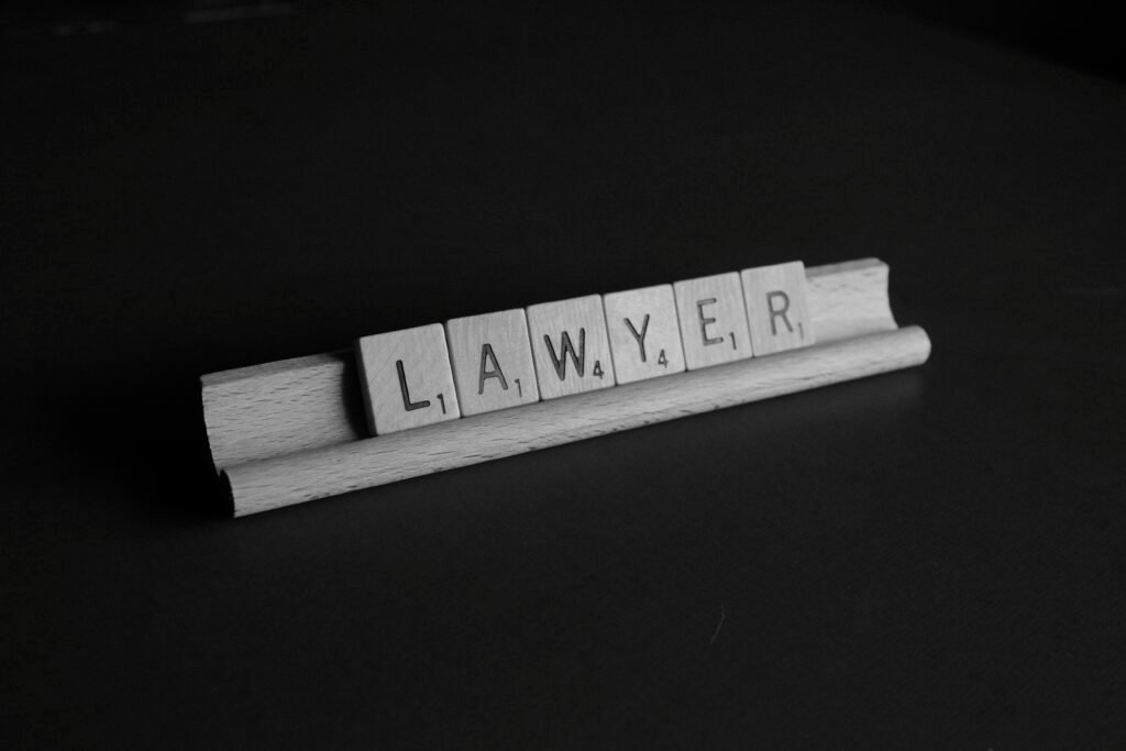 Professional business attorney reviewing legal documents with a business owner in a modern office, symbolizing trusted legal guidance and business protection.