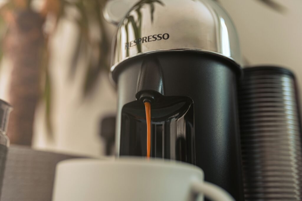 Collection of top Nespresso machines including VertuoPlus, CitiZ, Creatista Plus, and Vertuo Lattissima displayed on a modern kitchen countertop.