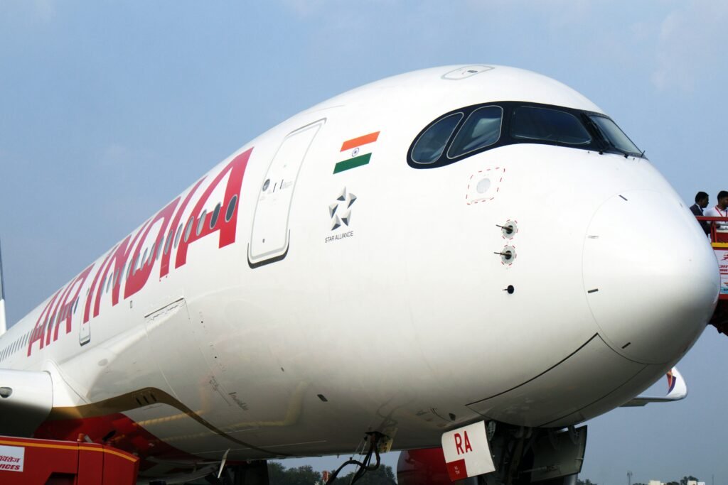 Air India Business Class cabin featuring lie-flat seats, premium dining service, modern interiors, and luxury travel amenities.