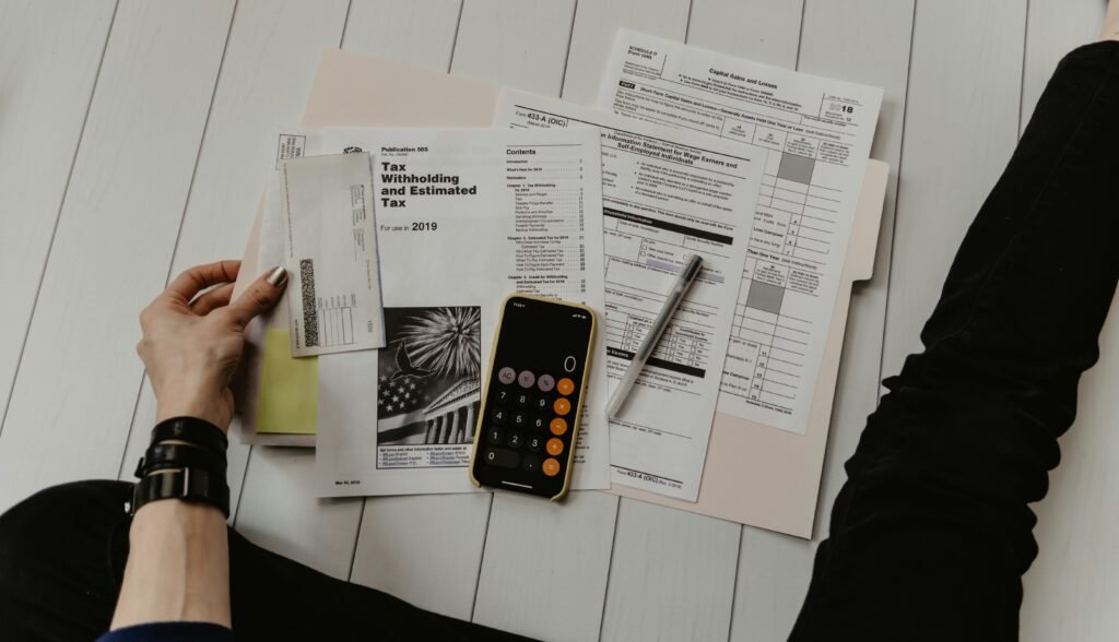 Financial counselor reviewing a household budget and debt repayment plan with a consumer during an American consumer credit counseling session.